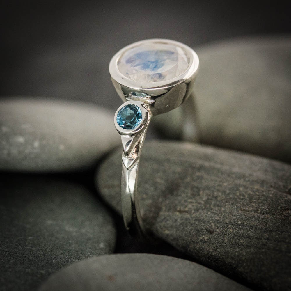 Handmade jewelry - Rainbow Moonstone Three Stone Ring and blue topaz ring by Cassin Jewelry.