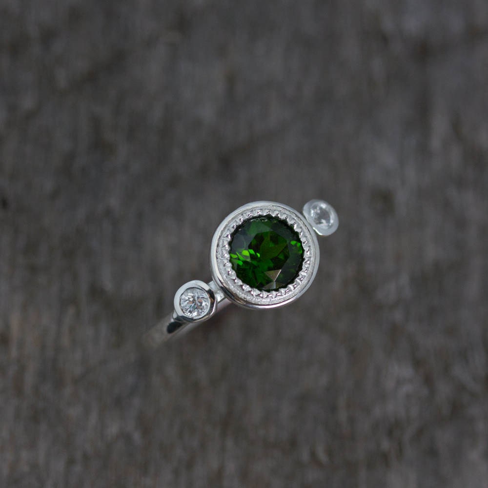 A handmade Chrome Diopside Ring featuring diamonds.