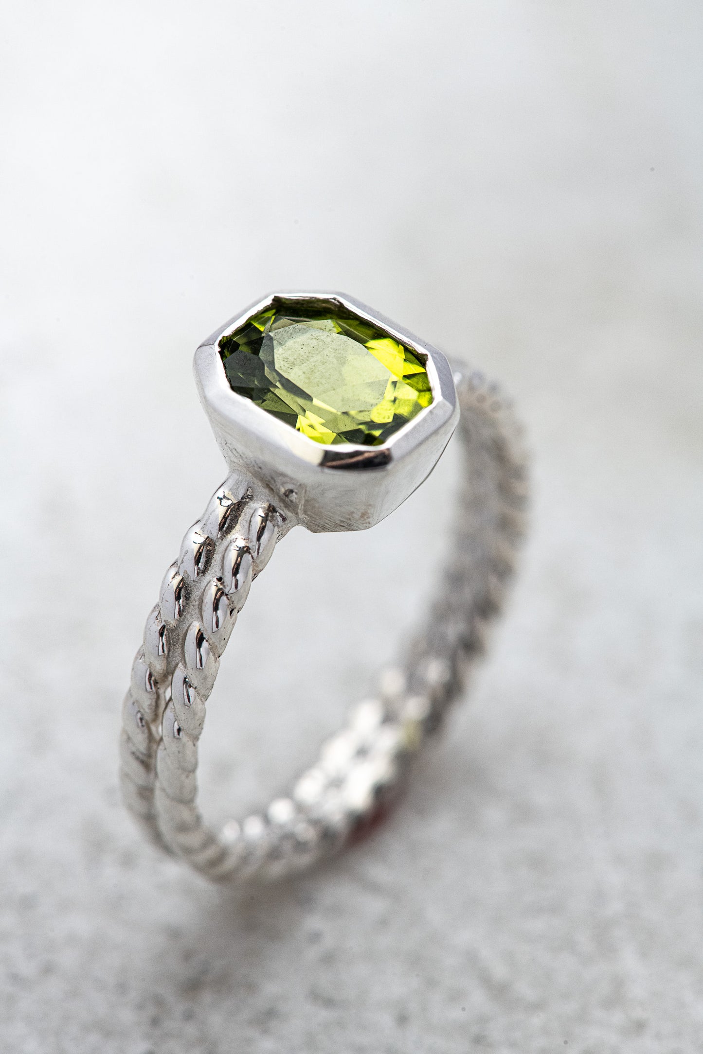 A handmade sterling silver ring with a One of a Kind Peridot stone.