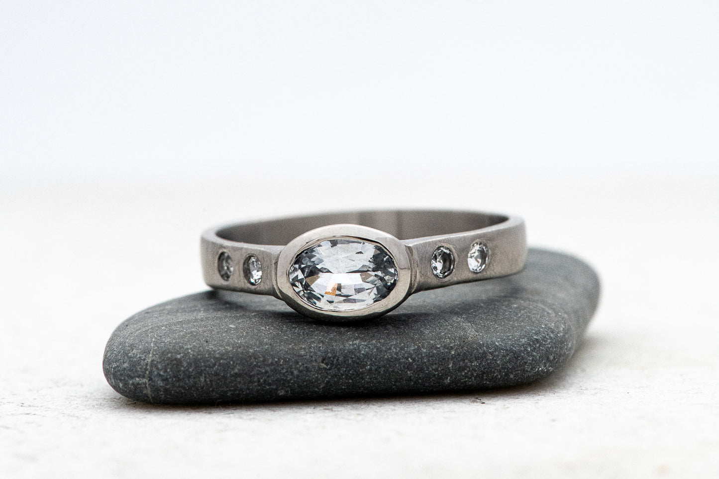 A Handmade White Sapphire Engagement Ring from Cassin Jewelry.